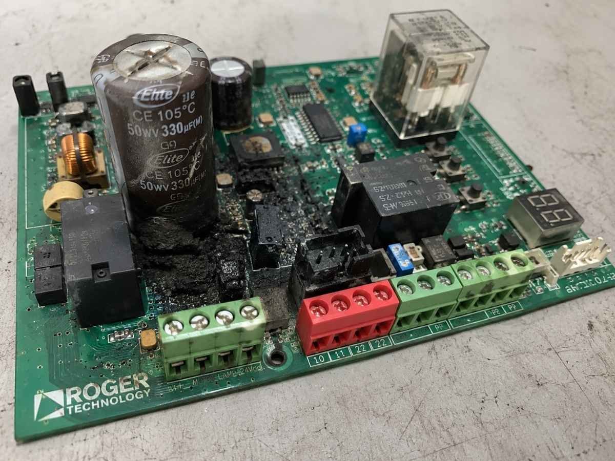 Roger Technology gate control board with heat damage and scorching around the power section